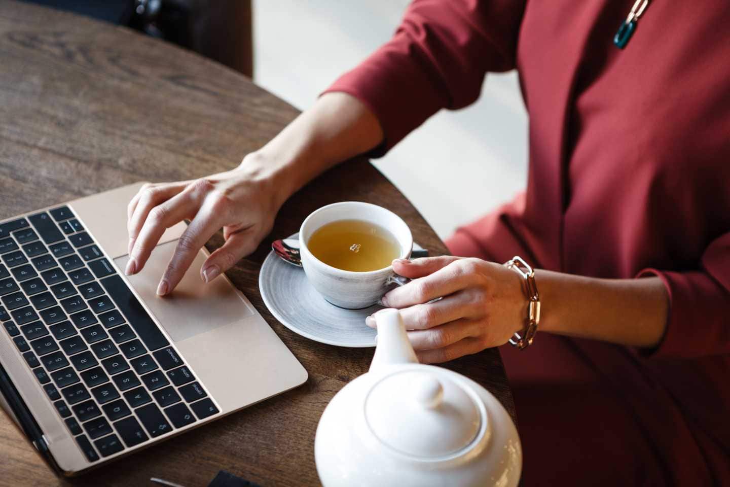 Woman at working with a delicious cup of tea - coffee services for offices, Dallas, Fort Worth, TX